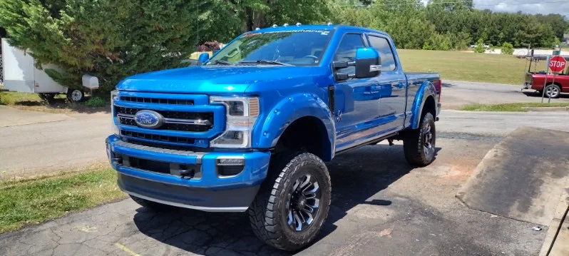 Lifted blue Ford F-250 Super Duty detailed by Grindtime Mobile Detailing