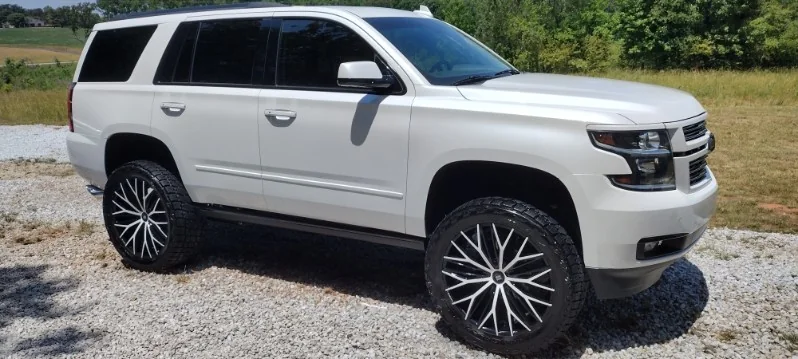 Lifted white Chevy Tahoe finished by Grindtime Mobile Detailing