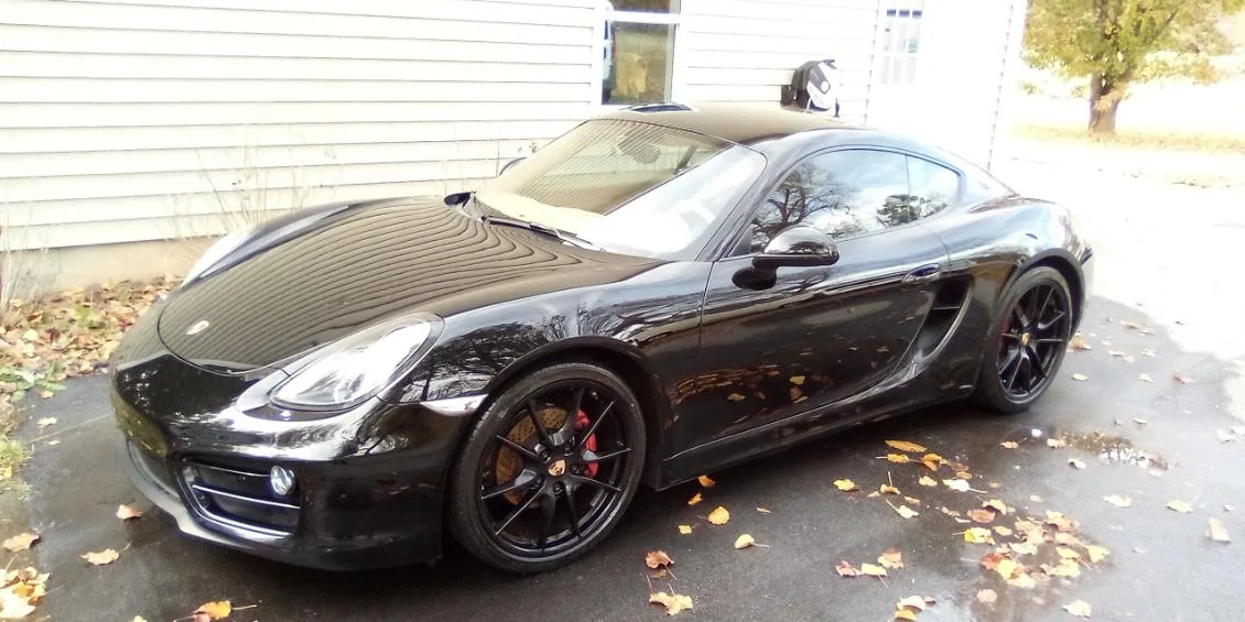 Black Porsche Cayman polished to a mirror finish by Grindtime