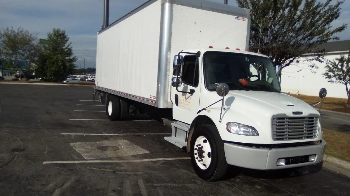 White Freightliner M2 box truck detailed on site by Grindtime